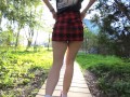 Naughty girl in miniskirt no panties flashing in the park (public upskirt)