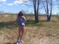 Hot teen shows tits and pussy in the woods near the road