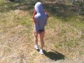 Hot teen shows tits and pussy in the woods near the road
