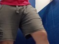 Muscle legs pose and piss at gym