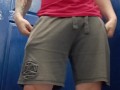 Muscle legs pose and piss at gym