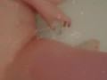 Beautiful baby gently caresses in the bathroom