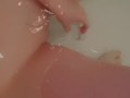 Beautiful baby gently caresses in the bathroom