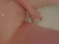 Beautiful baby gently caresses in the bathroom