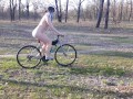 Peeping on a naked girl on a bike