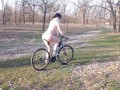 Peeping on a naked girl on a bike