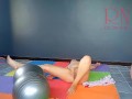 A girl without panties is engaged in yoga. The athlete takes off yoga leotards and shows her pussy.