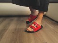 Girl in sexy red flip flops back from the beach