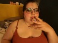 Chubby Hippie Sugar Dandy Smokes Two Cigarettes at Once