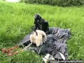 Rubber girl full in black latex catsuit and mask plays with herself outdoor in a meadow - Part 1