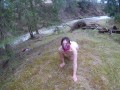Walking naked in the forest by a mountain river