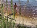 Sexy nudist girl on a wild beach
