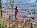 Sexy nudist girl on a wild beach