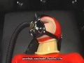 Hot girl full encased in red rubber suit enjoys gas mask breathplay in her black room