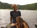 Horny couple pleasuring each other and making love passionately at a volcanic crater lake