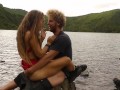 Horny couple pleasuring each other and making love passionately at a volcanic crater lake