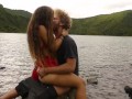 Horny couple pleasuring each other and making love passionately at a volcanic crater lake