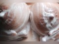 Watch me rub my big juicy tits in the shower