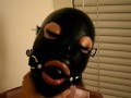 Bondage Girl Gagged in Latex Hood