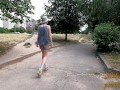 Slut walks in a mini dress with a fully transparent skirt