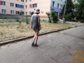 Slut walks in a mini dress with a fully transparent skirt