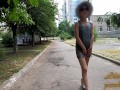 Slut walks in a mini dress with a fully transparent skirt