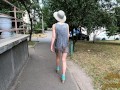 Slut walks in a mini dress with a fully transparent skirt