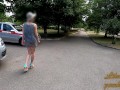 Slut walks in a mini dress with a fully transparent skirt