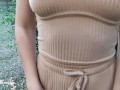 Alice in a beige suit sits in a bar walking down the street and posing near the mirror showing tits