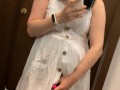 Pregnant beauty masturbates in a clothing store and tries on dresses