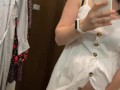Pregnant beauty masturbates in a clothing store and tries on dresses