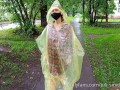 Risky flash of boobs and butt in the rain in a transparent raincoat