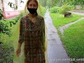 Risky flash of boobs and butt in the rain in a transparent raincoat