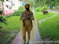 Risky flash of boobs and butt in the rain in a transparent raincoat