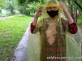 Risky flash of boobs and butt in the rain in a transparent raincoat