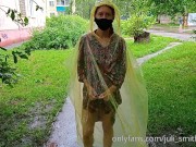 Risky flash of boobs and butt in the rain in a transparent raincoat