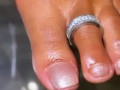 Ebony babe playing with her oiled feet