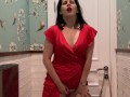 Hot brunette in red dress masturbates in a public restaurant