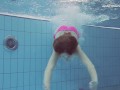 Pink swimswear babe Lera showing naked body underwater