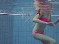 Pink swimswear babe Lera showing naked body underwater