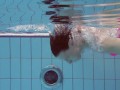 Pink swimswear babe Lera showing naked body underwater