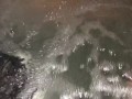 Sneak peak of my wife’s tits in our backyard hot tub tonight
