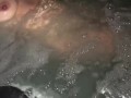 Sneak peak of my wife’s tits in our backyard hot tub tonight