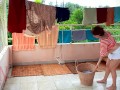 Naked laundry. The maid is drying clothes in the laundry.