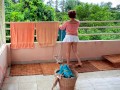 Naked laundry. The maid is drying clothes in the laundry.