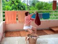 Naked laundry. The maid is drying clothes in the laundry.