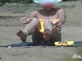 Mom undresses on the beach thinking that no one sees her