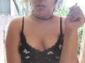 smoking a cigarette outside with my titties out