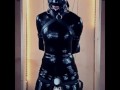 Latex doll in bondage gagged and blindfolded
