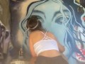 Girl with nice ass in booty shorts does graffiti